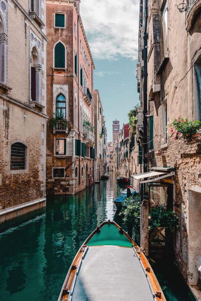 Captivating view of a traditional Venetian canal surrounded by historic buildings, perfect for travel enthusiasts.